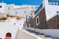 Fira street with whitewashed and blue houses on the island of Thira (Santorini), Greece. Royalty Free Stock Photo