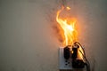 On fire adapter at plug Receptacle on white background