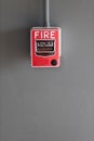 Fire alarm box on cement wall for warning and security system in the condominium place. standard safety in the resident, shopping Royalty Free Stock Photo