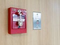 Fire alarm box with fire fighters telephone on wall for warning and security system Royalty Free Stock Photo