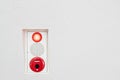 Fire alarm box on white wall Royalty Free Stock Photo