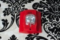 A fire alarm with built in strobe light to alert in case of fire glass Royalty Free Stock Photo