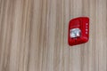 A fire alarm with built in strobe light to alert in case of fire. A sound and strobe fire alarm is mounted to an interior wall as Royalty Free Stock Photo
