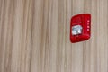 A fire alarm with built in strobe light to alert in case of fire. A sound and strobe fire alarm is mounted to an interior wall as Royalty Free Stock Photo