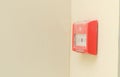 Fire alarm button on white wall.Fire safety for offices and shopping centers. Royalty Free Stock Photo