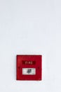 Fire alarm on cement wall Royalty Free Stock Photo