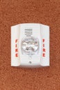 A fire alarm with siren and flashing strobe light. Royalty Free Stock Photo