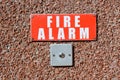 Fire alarm push button on wall of factory Royalty Free Stock Photo