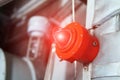 Fire alarm with red warning light of an emergency beacon at an industrial facility Royalty Free Stock Photo