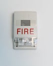 Fire alarm siren with flashing light strobe on white