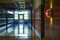 fire alarm strobe visible in modern school hallway Royalty Free Stock Photo