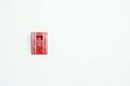 Fire alarm switch on white cement wall. Royalty Free Stock Photo