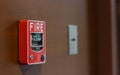 Fire alarm switch on wooden wall with copy space. warning and security system concept Royalty Free Stock Photo