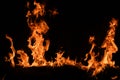 Fire blaze flames on black background. Fire burn flame isolated, abstract texture. Flaming explosion effect with burning Royalty Free Stock Photo