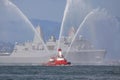 Fire-boat with Naval Ship Royalty Free Stock Photo