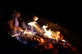 Fire bonfire burning firewood. The flame of fire burns in an open furnace at night. Royalty Free Stock Photo