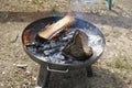 Fire in a fire bowl, big wooden grill with cinder Royalty Free Stock Photo