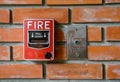 Fire break glass alarm switch on brick wall Royalty Free Stock Photo