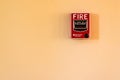 Fire break glass alarm switch on the cement wall. Royalty Free Stock Photo