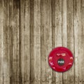 Fire break glass alarm switch on wooden wall background Royalty Free Stock Photo