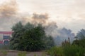 A fire brigade on a fire engine extinguishes a forest fire. Inscriptions on the car in Russian - fire truck and Odessa. 2019. 06. Royalty Free Stock Photo