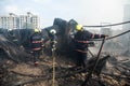 Fire brigade officials douse fire