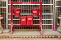 fire buckets in red filled with sand to prevent fire in India Royalty Free Stock Photo