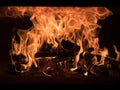 Fire and burn coals in stone oven. Oven made of brick and clay on the wood. Oven for pizza Royalty Free Stock Photo