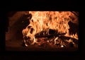 Fire and burn coals in stone oven. Oven made of brick and clay on the wood. Oven for pizza Royalty Free Stock Photo