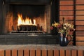 Fire burning with artificial log in fireplace Royalty Free Stock Photo