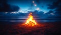 A fire is burning on a beach at night Royalty Free Stock Photo