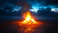 A fire is burning on a beach at night Royalty Free Stock Photo