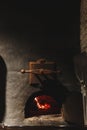 Fire burning in black iron stove, closeup Royalty Free Stock Photo