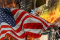 Fire burning in the engulfs small house and the American Flag Royalty Free Stock Photo