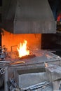 High-grade fire in the forge for working iron in a blacksmith\'s workshop. Royalty Free Stock Photo