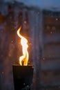 Fire burning inside metal torch