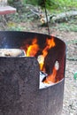 A fire burning in a metal fire ring