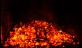 A fire burns in a fireplace, close up shot of burning firewood in the fireplace Royalty Free Stock Photo