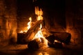 A fire burns in a fireplace  Fire to keep warm Royalty Free Stock Photo