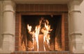 A fire burns in a fireplace, Fire to keep warm. Close up shot of burning firewood in the fireplace Royalty Free Stock Photo