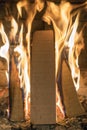 A fire burns in a fireplace, Fire to keep warm. Close up shot of burning firewood in the fireplace. vertical photo Royalty Free Stock Photo