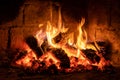 A fire burns in a fireplace  Fire to keep warm Royalty Free Stock Photo