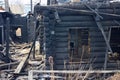 After fire - burnt house. Black burned wooden walls