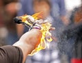 Fire busker juggle arm closeup