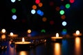 Fire of candle on christmas background. Christmas candles burning at night. Abstract candles background. Royalty Free Stock Photo