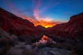 fire canyon sunset, with fiery reds and oranges shining against the blue sky