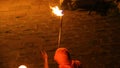 Fire caster holding ancient ritual pronouncing spell over torch, traditions