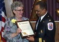 The Prince George`s County Fire Chief give a award to the a member of lfire department`s ladies auxilary adi