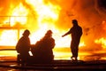 Fire chief giving instructions to firefighters during a firefighting exercise