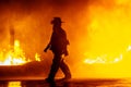 Fire chief walking in front of fire during a firefighting exercise Royalty Free Stock Photo